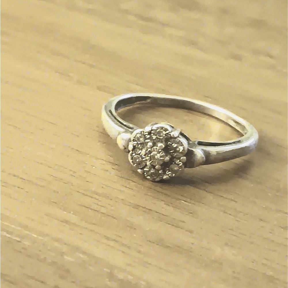 Flower diamond ring from Helzberg Diamonds with sterling silver band.